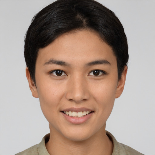 Joyful asian young-adult female with short  brown hair and brown eyes