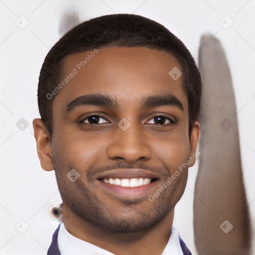 Joyful black young-adult male with short  black hair and brown eyes