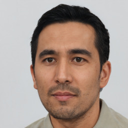 Neutral asian adult male with short  black hair and brown eyes