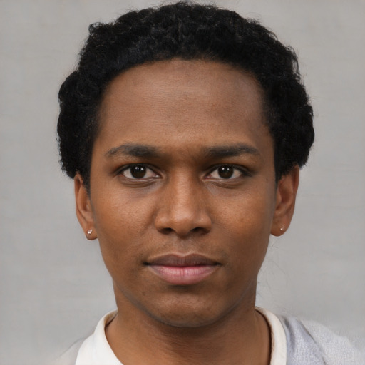 Neutral black young-adult male with short  black hair and brown eyes
