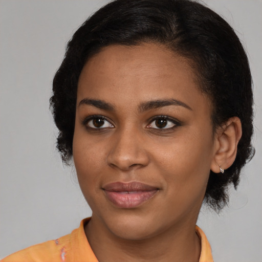 Joyful latino young-adult female with short  brown hair and brown eyes