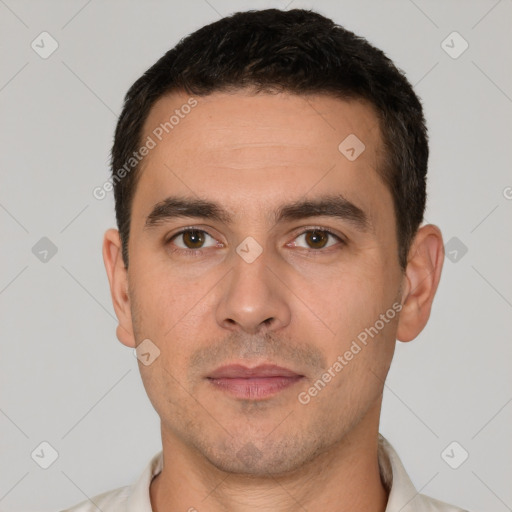 Joyful white young-adult male with short  brown hair and brown eyes