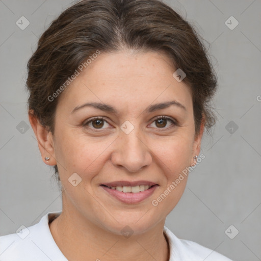 Joyful white adult female with short  brown hair and brown eyes