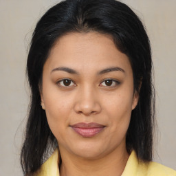 Joyful asian young-adult female with medium  brown hair and brown eyes