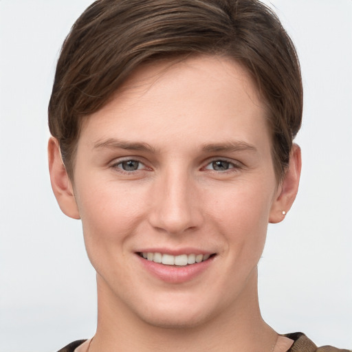 Joyful white young-adult female with short  brown hair and grey eyes