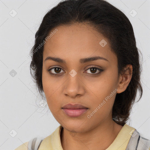 Joyful latino young-adult female with long  brown hair and brown eyes