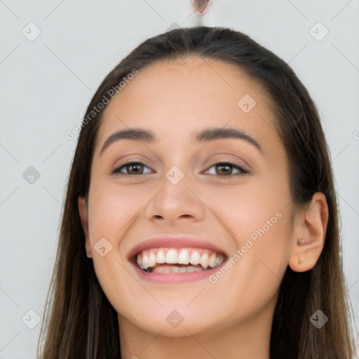 Joyful white young-adult female with long  brown hair and brown eyes