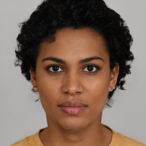 Neutral black young-adult female with short  black hair and brown eyes
