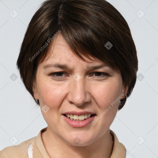 Joyful white adult female with medium  brown hair and grey eyes