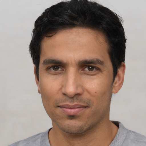 Neutral white young-adult male with short  black hair and brown eyes