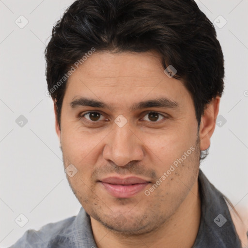 Joyful white adult male with short  brown hair and brown eyes