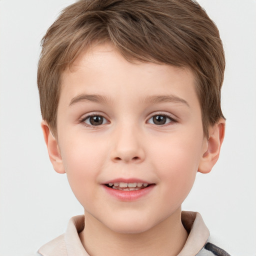 Joyful white child male with short  brown hair and brown eyes