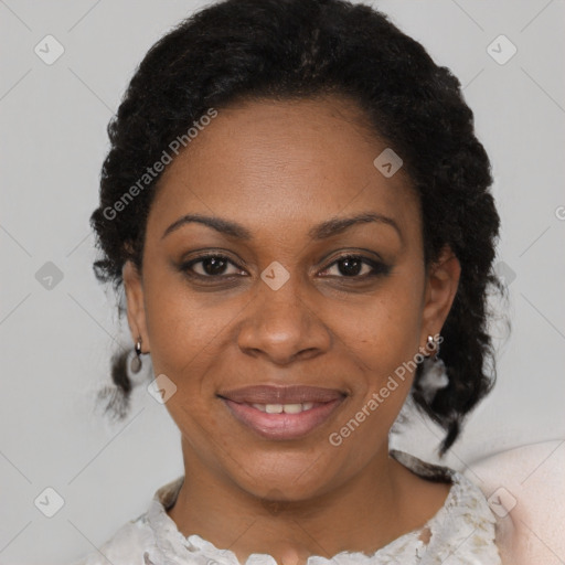 Joyful black adult female with short  brown hair and brown eyes