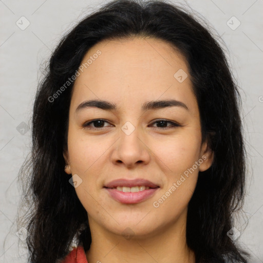 Joyful latino young-adult female with long  brown hair and brown eyes