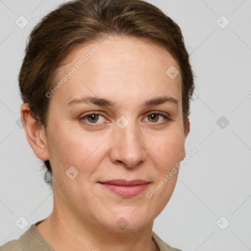 Joyful white adult female with short  brown hair and grey eyes