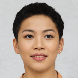 Joyful asian young-adult female with short  black hair and brown eyes