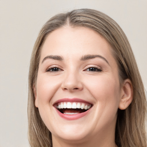 Joyful white young-adult female with long  brown hair and grey eyes