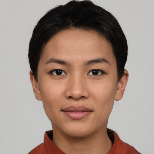 Joyful asian young-adult female with short  black hair and brown eyes