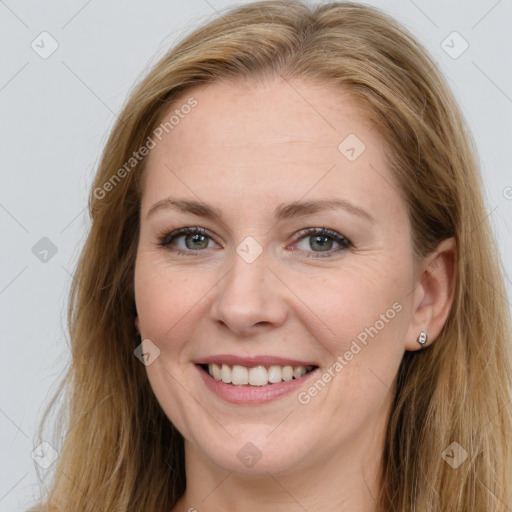 Joyful white young-adult female with long  brown hair and blue eyes