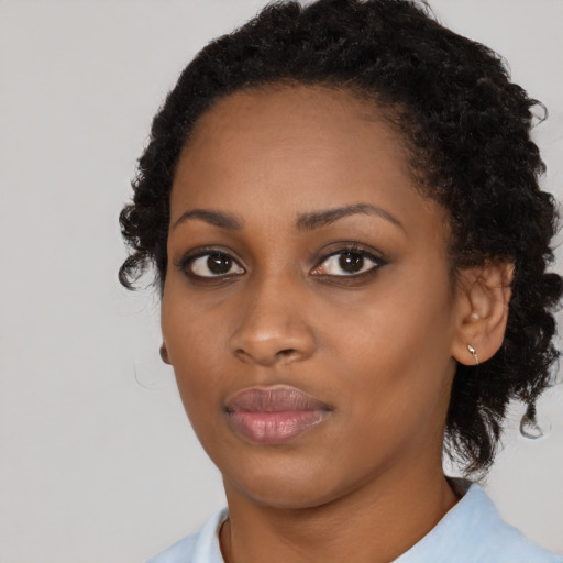 Neutral black young-adult female with medium  black hair and brown eyes