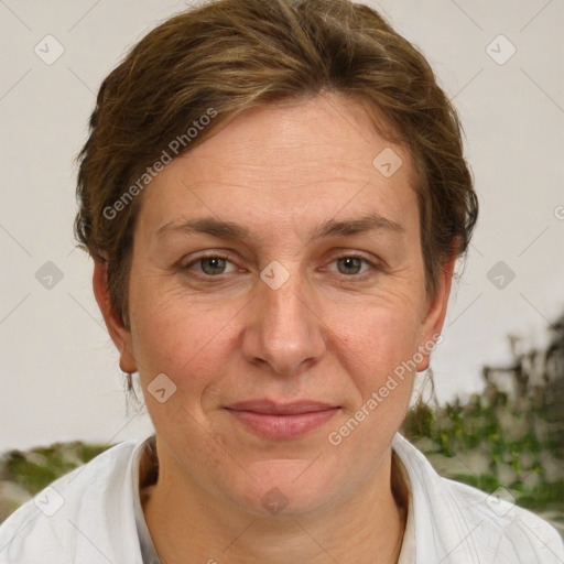 Joyful white adult female with short  brown hair and brown eyes