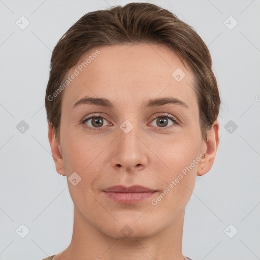 Joyful white young-adult female with short  brown hair and grey eyes