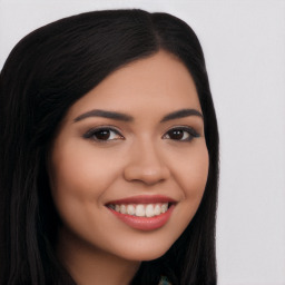 Joyful latino young-adult female with long  black hair and brown eyes