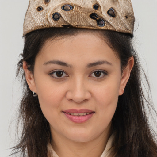 Joyful latino young-adult female with long  brown hair and brown eyes