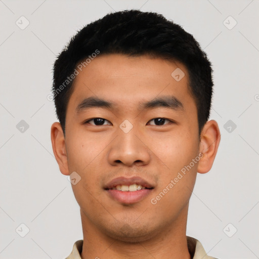 Joyful asian young-adult male with short  black hair and brown eyes