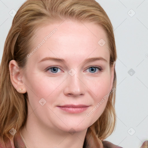 Joyful white young-adult female with long  brown hair and blue eyes