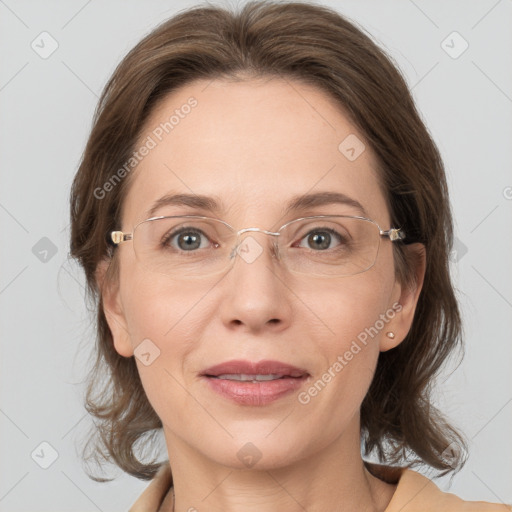 Joyful white adult female with medium  brown hair and grey eyes