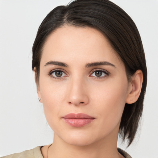 Neutral white young-adult female with medium  brown hair and brown eyes