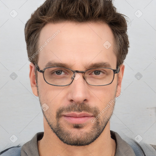 Neutral white young-adult male with short  brown hair and grey eyes