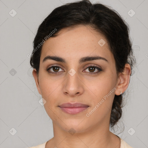 Joyful latino young-adult female with medium  brown hair and brown eyes