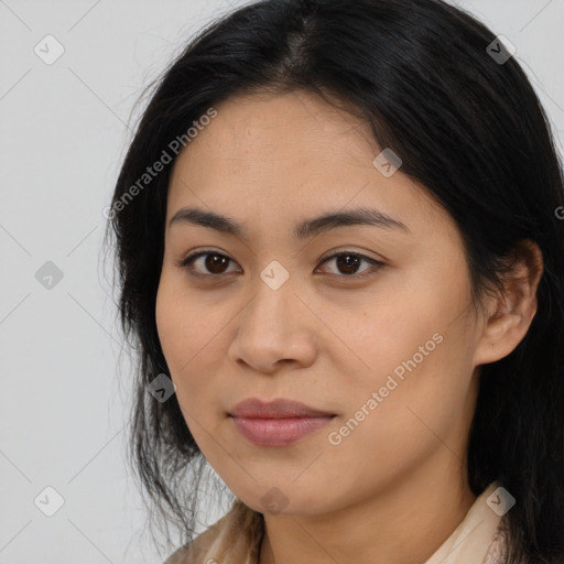 Joyful latino young-adult female with long  brown hair and brown eyes