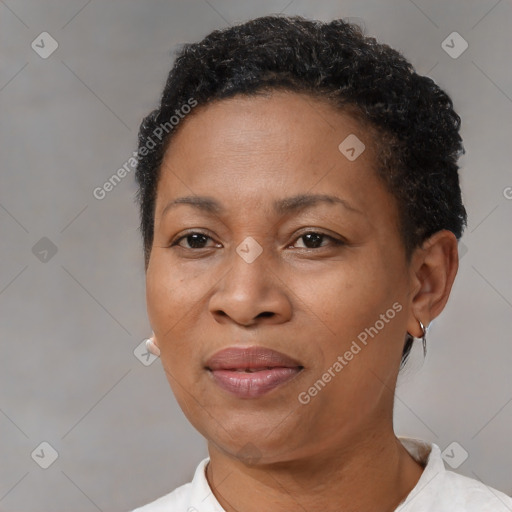 Joyful black adult female with short  brown hair and brown eyes