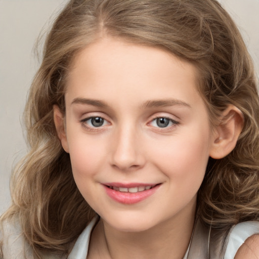 Joyful white child female with medium  brown hair and brown eyes