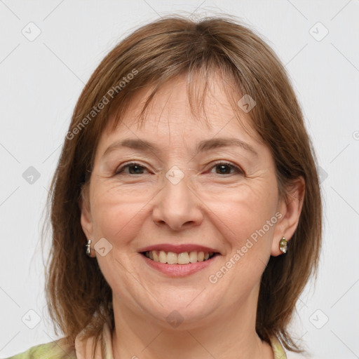 Joyful white adult female with medium  brown hair and grey eyes