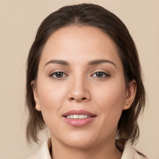 Joyful white young-adult female with medium  brown hair and brown eyes