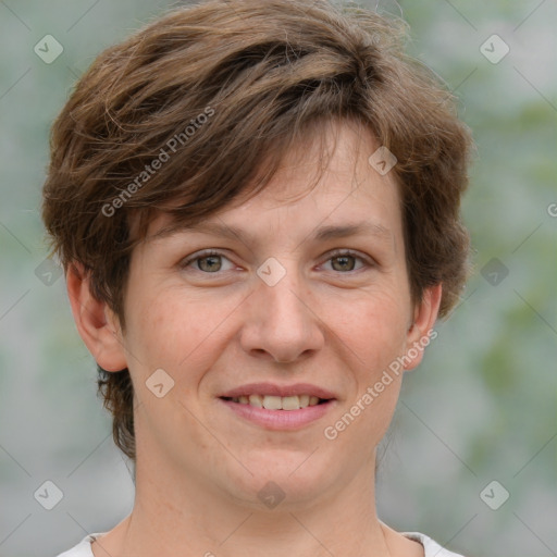 Joyful white adult female with short  brown hair and grey eyes