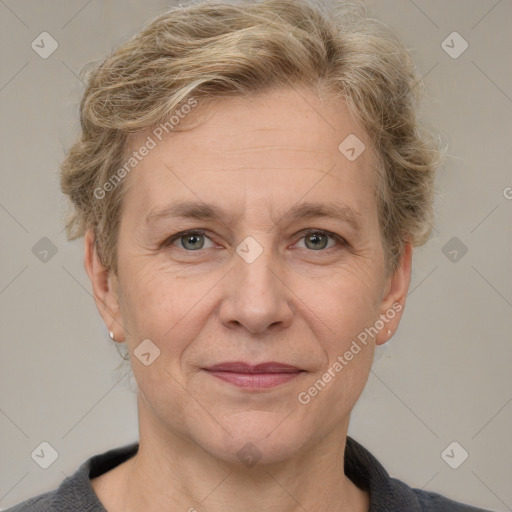 Joyful white adult female with short  brown hair and grey eyes