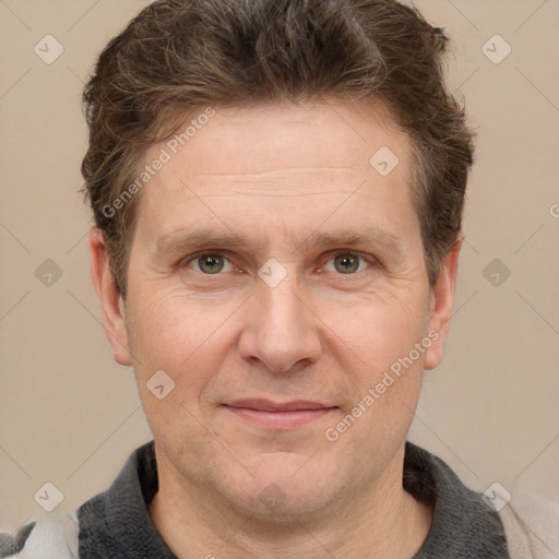 Joyful white adult male with short  brown hair and grey eyes