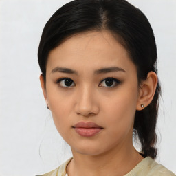 Neutral asian young-adult female with medium  brown hair and brown eyes