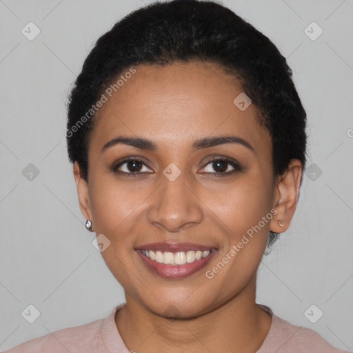 Joyful latino young-adult female with short  black hair and brown eyes