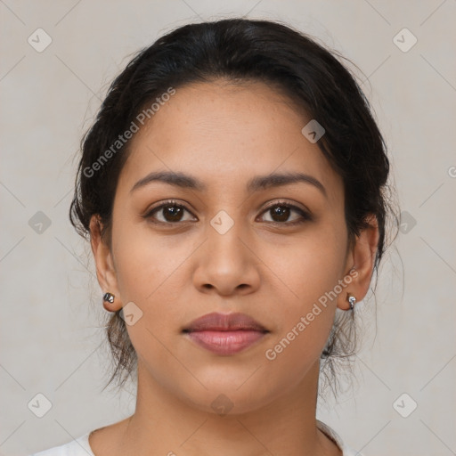 Joyful latino young-adult female with medium  brown hair and brown eyes