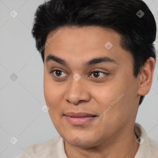 Joyful white young-adult male with short  black hair and brown eyes