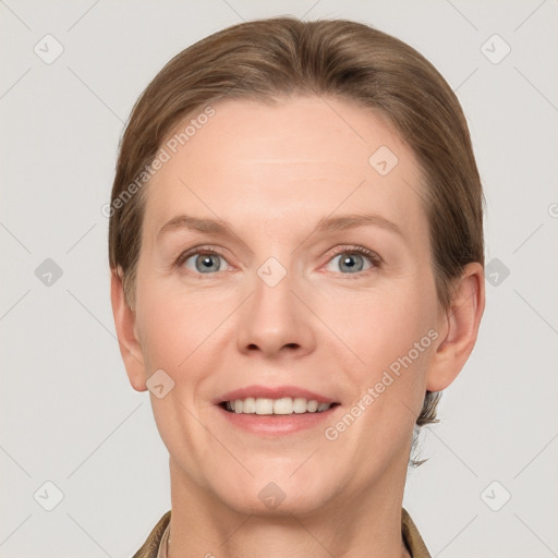 Joyful white adult female with short  brown hair and grey eyes