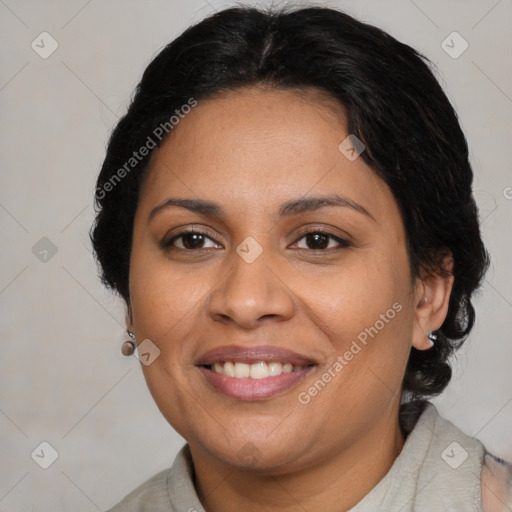 Joyful latino adult female with medium  brown hair and brown eyes