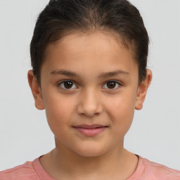 Joyful white child female with short  brown hair and brown eyes