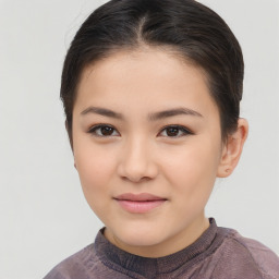 Joyful white child female with short  brown hair and brown eyes